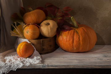 Harvest of pumpkins of different varieties on the table.