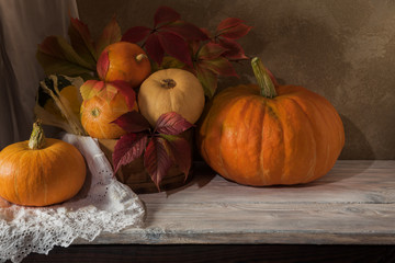 Harvest of pumpkins of different varieties on the table.