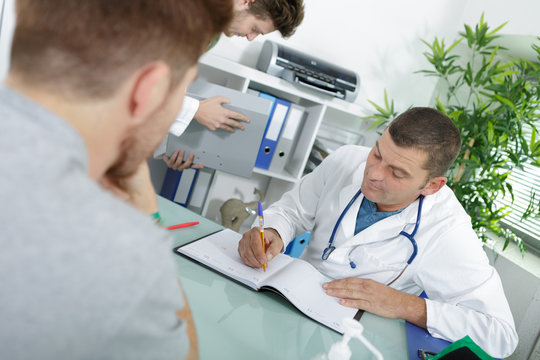 man as doctor or physician during consultation at his office