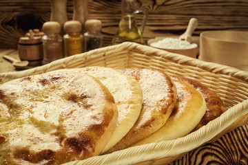 Traditional Georgian bread - khachapuri and Kolkh khachapuri on the table.Homemade baking. Flat lay, overhead.Khachapuri with cheese,georgian khachapuri megruli with cheese,Traditional Georgian pie