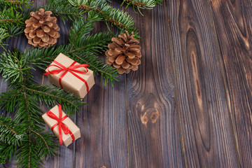 Christmas presents on wooden background, retro style with copy space