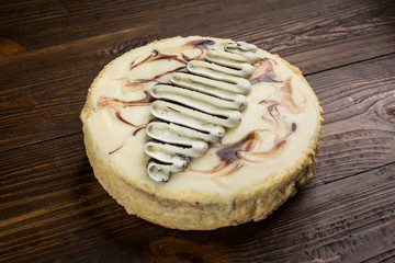 chocolate cake with cream and poppy seeds,Chocolate cake with a cut piece and blade on dark background, closeup,Delicious vegan chocolate cake,Tasty chocolate cake on wooden background