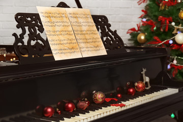 New year decorations on piano keyboard. Christmas music concept