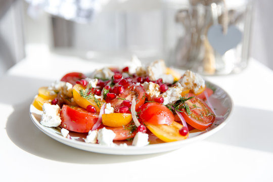 Tomato, feta and pomegranate salad