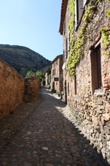 Fototapeta na wymiar Street in french village of Castelnou in Pyrenees orientales, France