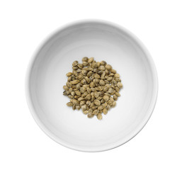 Bowl with hemp seeds on white background