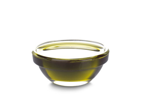 Bowl with hemp oil on white background