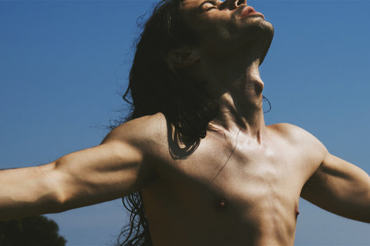 man in the sun and blue sky