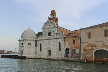 Fototapeta na wymiar Church San Michele on island behind walls of Venice Cemetery