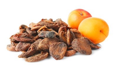 Dried and fresh apricots on white background