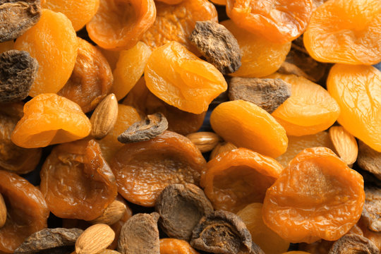Dried apricots and nuts as background