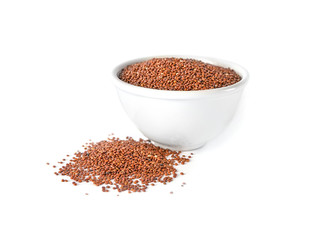 Raw quinoa grains in bowl on white background
