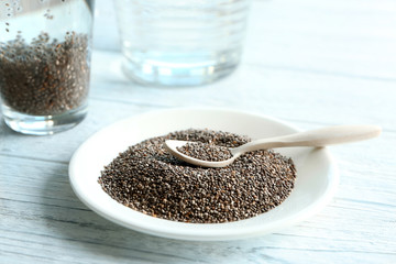 Chia seeds and spoon on plate