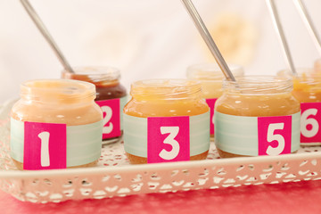 Jars with different puree on table. Game 