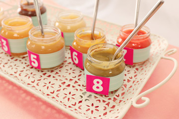 Jars with different puree on table. Game 