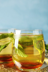 Two glasses with mint julep on metal tray