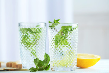 Two glasses with mint julep on table