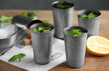 Glasses with mint julep on kitchen table