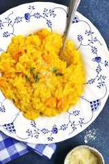 Spicy pumpkin risotto with garlic,thyme and parmesan cheese.Top view.