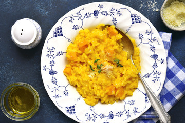 Spicy pumpkin risotto with garlic,thyme and parmesan cheese.Top view.