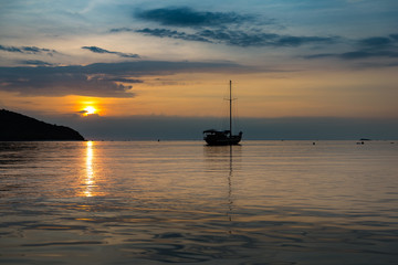twilight scene of boat at koh phangan in the sunset time
