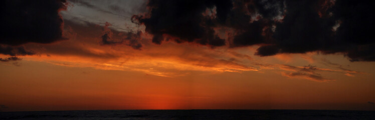 Fototapeta na wymiar Cloudy Panoramic Sunset in Sicily