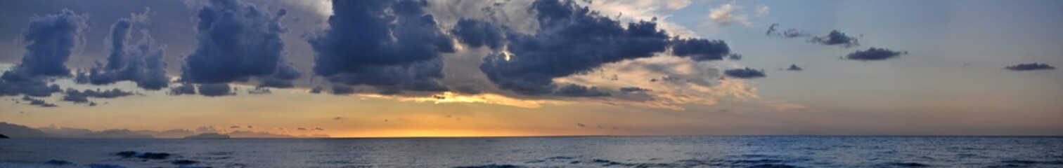 Naklejka na ściany i meble Cloudy Panoramic Sunset in Sicily