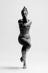 Foto op Aluminium Young beautiful yoga female posing in studio © Alexander Y