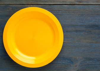 plate on a wooden background. plate top view. copy space