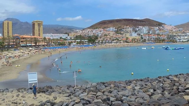 Aerial drone shot of beach and resort in Los Cristianos Tenerife Spain