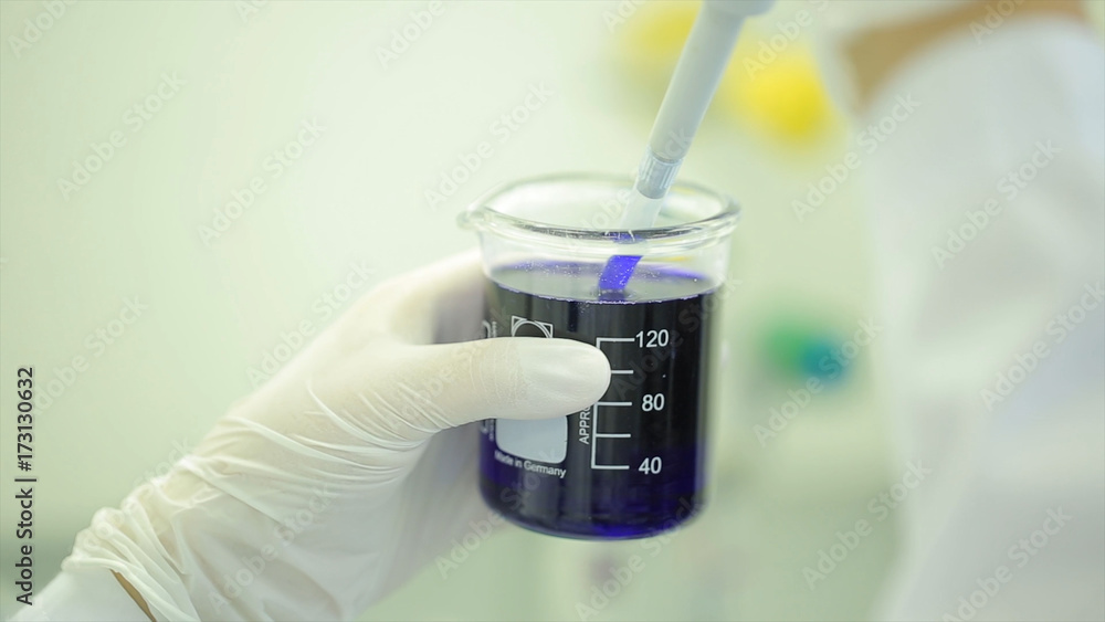 Poster test tubes closeup. medical equipment. close-up footage of a scientist using a micro pipette in a la