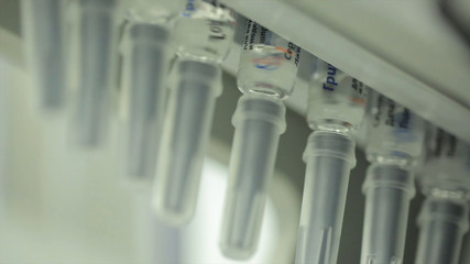 Pharmaceutics. Pharmaceutical worker operates tablet blister packaging machine. manufacture of...