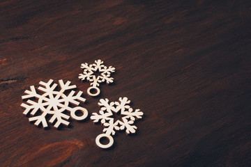 Wooden snowflakes on a dark background