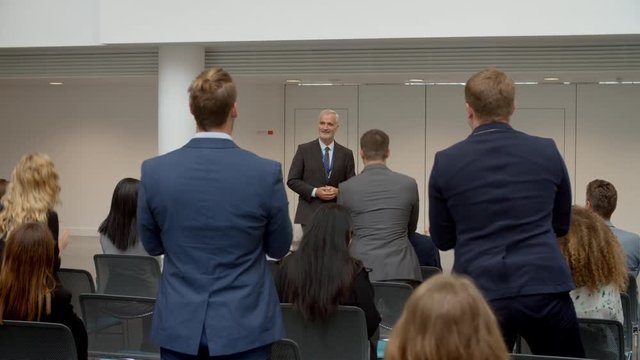 Audience Applauding Speaker After Conference Presentation