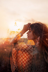 close up of beautiful young woman at sunset © zolotareva_elina