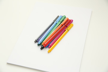 colours pen on blank paper