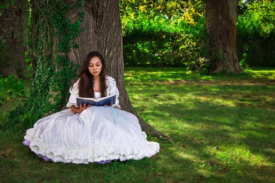 Girl reading in woods 1