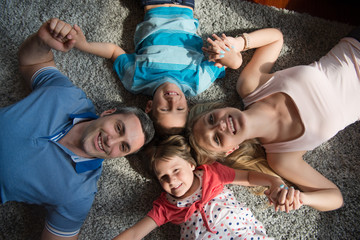 happy family lying on the floor