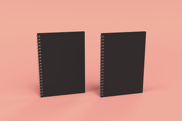Two notebooks with spiral bound on red background