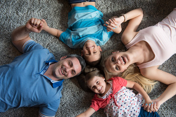 happy family lying on the floor