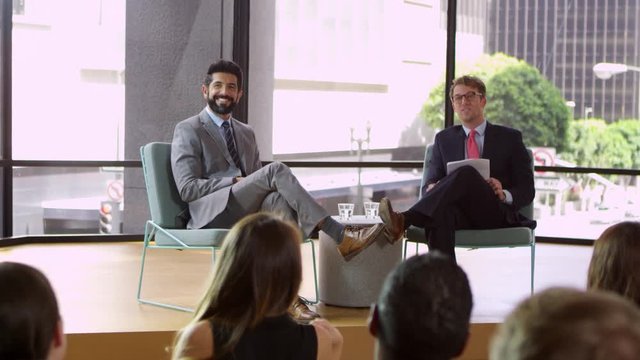 Male speakers at business seminar take question from audience, shot on R3D