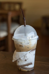 Iced coffee on the table with nature light.