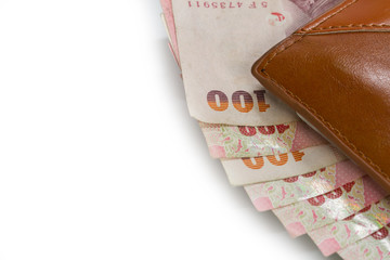 Thai banknotes in a wallet on white background