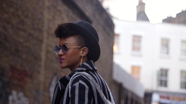 Stylish Fashion Blogger Walking Along Urban Street