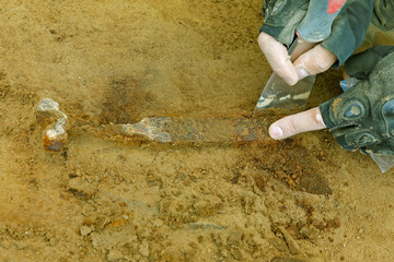 A broken ancient bronze knife is an archaeological find.
