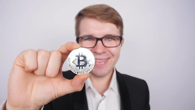 Man holding bitcoin in his hand
