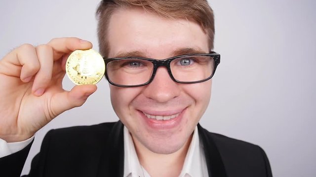Man holding bitcoin in his hand