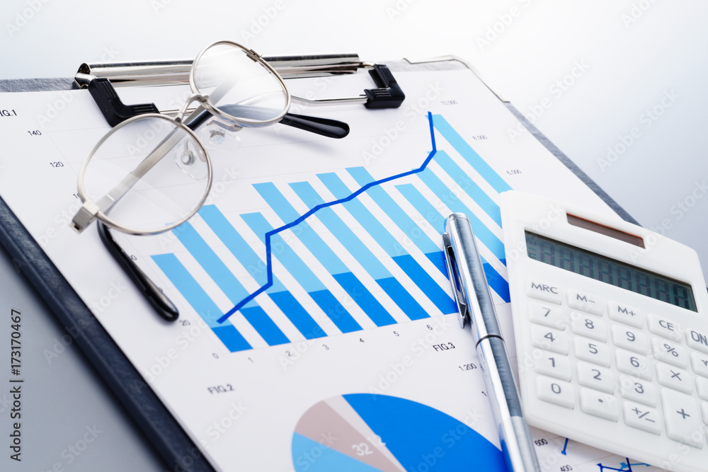 Aufkleber Reviewing business report. Deriving result from statistics. Document, glasses and calculator on reflection background.
