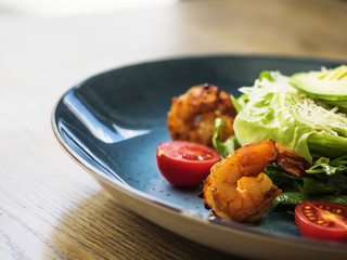 Salad with tiger shrimps