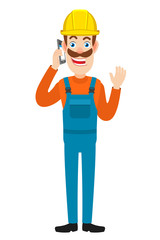 Builder talking on mobile phone and raised a hand in greeting
